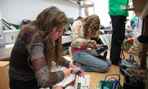 Leah and Millie looking for parts in e-waste stock