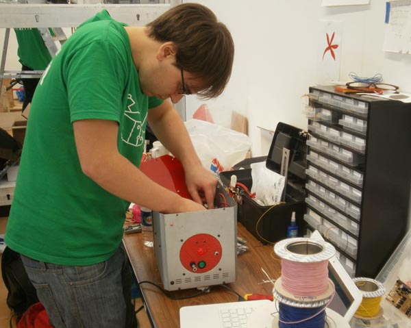 Sean Olsen at work on Hood the red robot